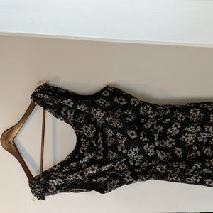 Flattering black cowl neck dress with white floral pattern